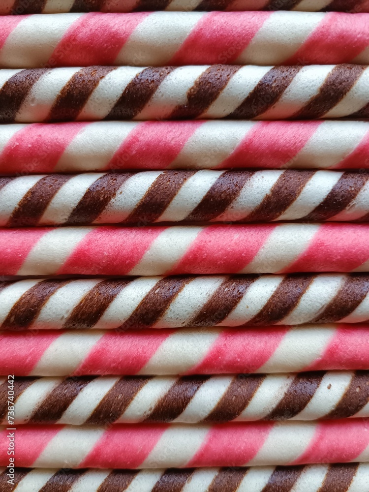 Pink and Brown Wafer Sticks arranged horizontal Pink and Brown Wafer Sticks arranged horizontal