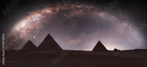 The Milky Way rises over the Pyramids in Giza, Egypt photo
