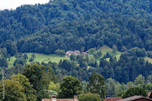 Scenic landscape with traditional houses at Slovenian City of Skofja Loka on a cloudy summer day. Photo taken August 9th, 2023, Škofja Loka, Slovenia.