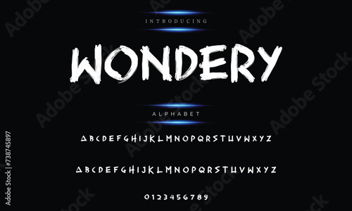 A dark background with an isolated typeface. Street art and graffiti style use the texture alphabet. a gritty, unclean look.  Brush lettering in vector form.