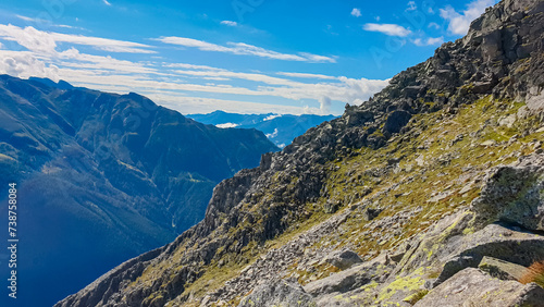 Rough terrain with scenic view of alpine valley and majestic mountain peaks in High Tauern National Park, Carinthia, Austria. Idyllic hiking trail. Austrian Alps in summer. Hike paradise Mallnitz