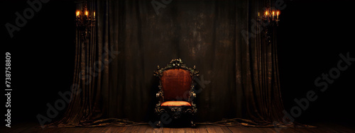 ornate red velvet throne in dark room with brown curtains and sconces