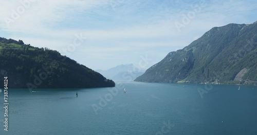 Lucerne in Swiss.View to the Lake of the four forested settlements  from Urnersee, south of Brunnen. Passage entre Treib and slopes of Bärfallen and Grat with the Pilatus on Western horizon photo