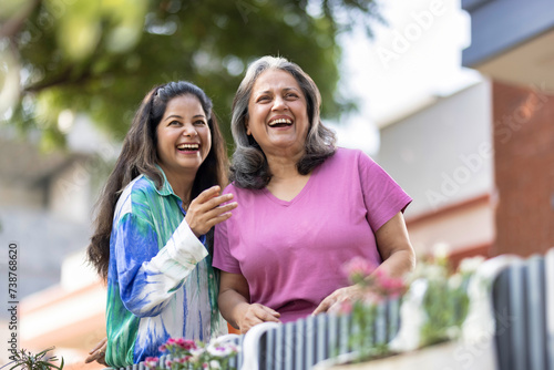 Photography Two cheerful senior female spending leisure time together at outdoor