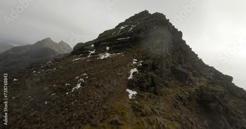 Flying to the summit of Sgurr nan Eag located in the Cuillin mountains on the Isle of Skye, Scotland.
 photo