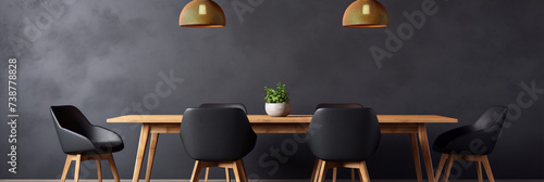 Black minimalist dinning room with a wooden table and chairs. photo