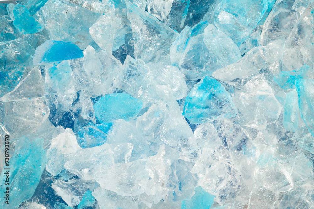broken ice close up. pieces of crushed blue ice cracks background texture. close-up frozen water. broken ice close up. pieces of crushed blue ice cracks background texture. close-up frozen water.