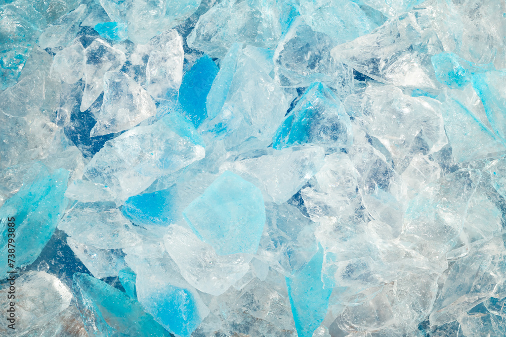 broken ice close up. pieces of crushed blue ice cracks background texture. close-up frozen water. broken ice close up. pieces of crushed blue ice cracks background texture. close-up frozen water.