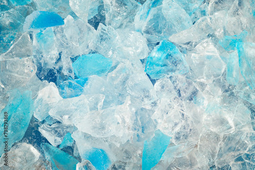 broken ice close up. pieces of crushed blue ice cracks background texture. close-up frozen water.