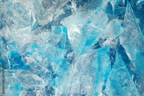 broken ice close up. pieces of crushed blue ice cracks background texture. close-up frozen water.