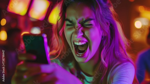 excited young woman play games by mobile phone make winner gesture. female winning mobile gambling. Wow face expression. Esport streaming game online, surprise, gamer, online, earning, new generation.