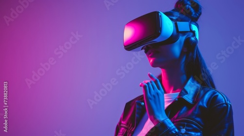 Woman with VR headset illuminated by neon lights, reflecting a high-tech, immersive virtual experience.