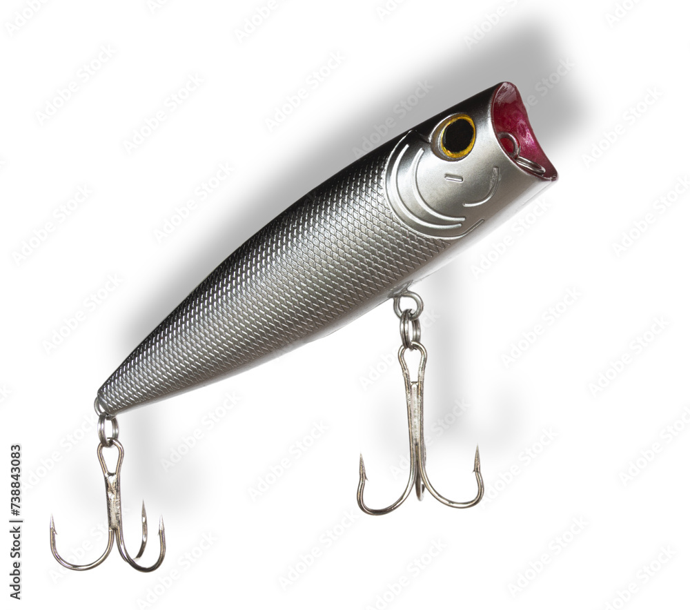 Light shadow above and behind a large topwater artificial fishing lure Light shadow above and behind a large topwater artificial fishing lure