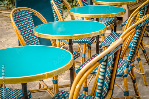 Typical table and chairs in the streets of Paris, France