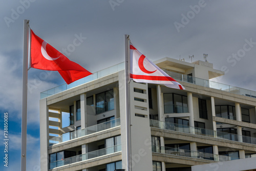 flags of Turkey and Northern Cyprus against the sky on a sunny winter day 2