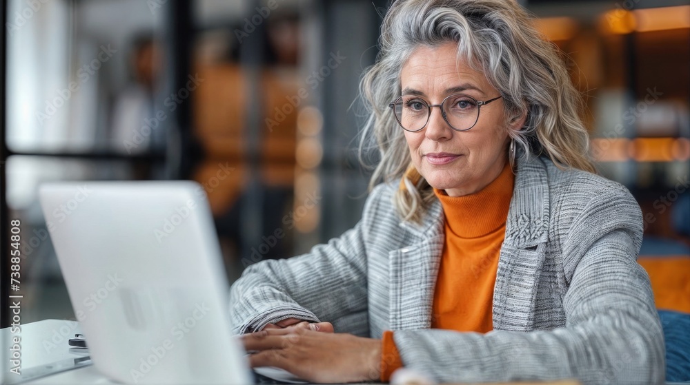 Executive Insight: Middle-Aged Businesswoman Contemplates Digital Strategy at Desk Executive Insight: Middle-Aged Businesswoman Contemplates Digital Strategy at Desk