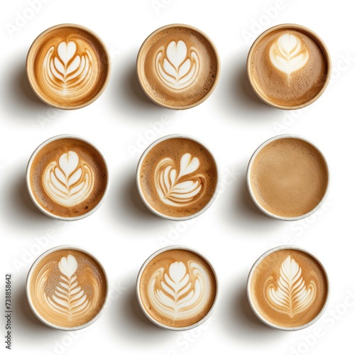 Set of paper takeaway cups of different latte art isolated on a white background, top view