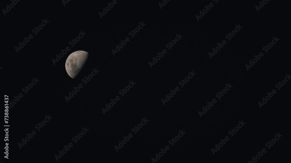 waxing gibbous moon moves across the sky, a plane crosses the moon as it makes its way from bottom right frame to top left waxing gibbous moon moves across the sky, a plane crosses the moon as it makes its way from bottom right frame to top left