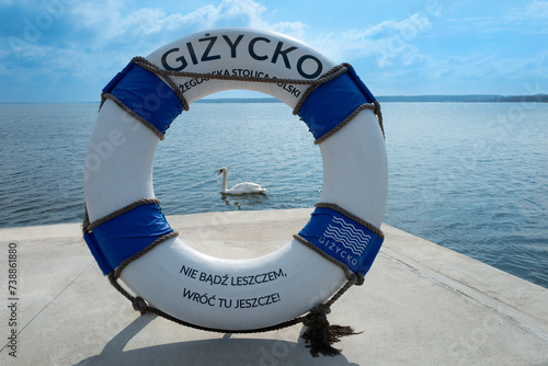 Fototapeta Naklejka Na Ścianę i Meble -  2023-04-18 embankment with the symbol of the city Gizycko Poland