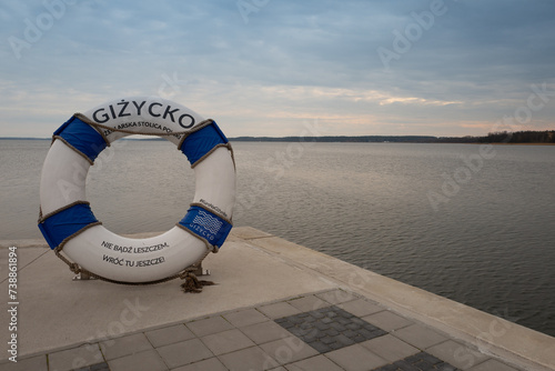 Fototapeta Naklejka Na Ścianę i Meble -  2023-04-18 embankment with the symbol of the city Gizycko Poland