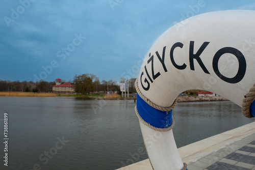Fototapeta Naklejka Na Ścianę i Meble -  2023-04-18 embankment with the symbol of the city Gizycko Poland