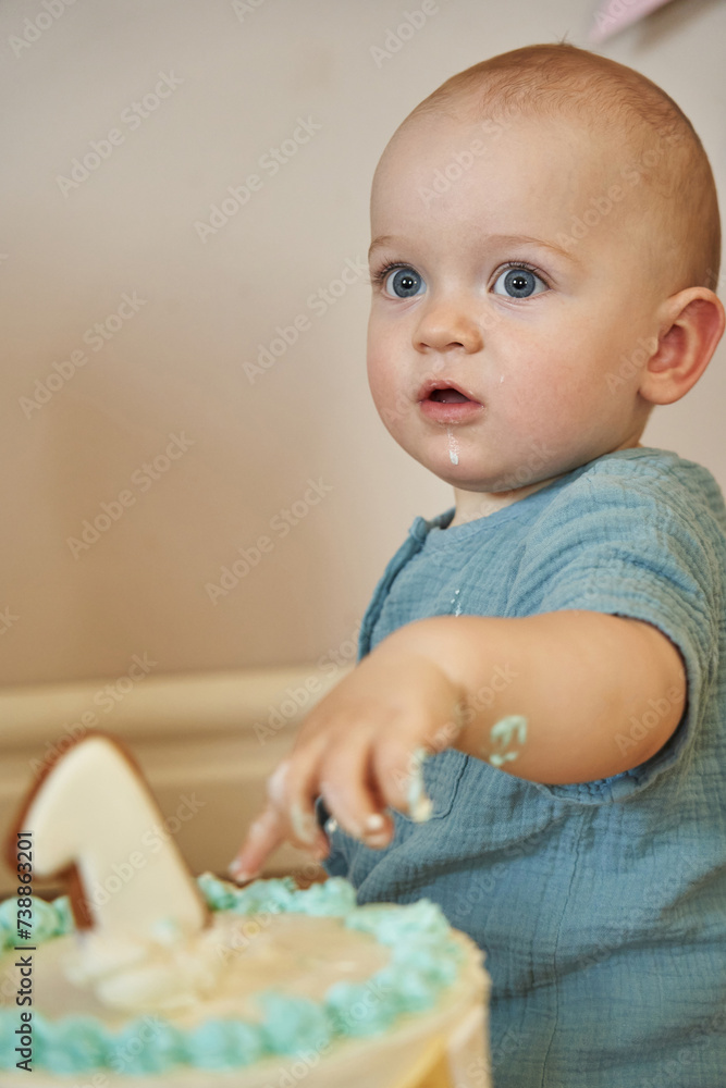 The birthday boy relishes every bite of his cake as he turns one. The birthday boy relishes every bite of his cake as he turns one.