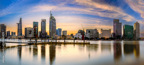 Very beautiful sunset panorama over buildings along the Saigon River in Ho Chi Minh City, Vietnam. photo