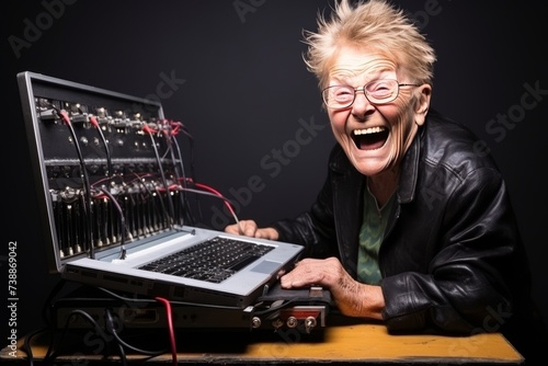 An elderly woman laughs ominously using a laptop and wires to hack and hack the system