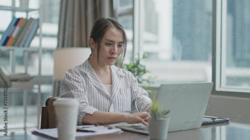 business woman in stress works at a laptop while sitting at a table at home,chronic fatigue working late after hours,Exhausted businesswoman in office business woman in stress works at a laptop while sitting at a table at home,chronic fatigue working late after hours,Exhausted businesswoman in office