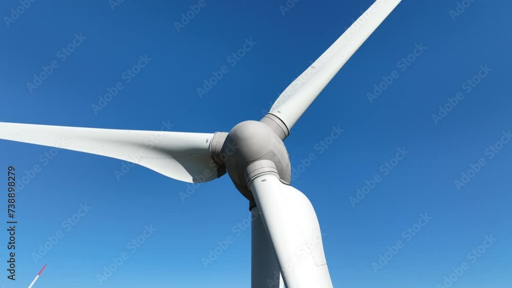 Aerial view of powerful Wind turbine farm for energy production on beautiful cloudy sky at highland. Wind power turbines generating clean renewable energy for sustainable development 4k footage. Aerial view of powerful Wind turbine farm for energy production on beautiful cloudy sky at highland. Wind power turbines generating clean renewable energy for sustainable development 4k footage.