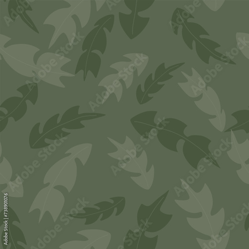 Dandelion Leaves in Muted Greens Scattered on a Green Background Give this Vector Repeat Seamless Pattern Design a Look of Camouflage
