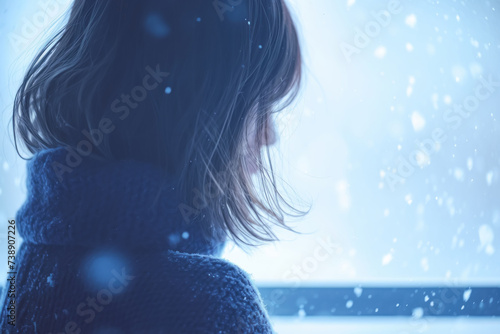 Sullen Teen Emptily Watching Snow on Dull Holiday photo
