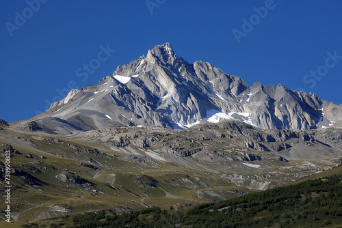 Majestic mountain peak rising sharply against a clear blue sky, rugged texture and grand scale, embodying the power of nature