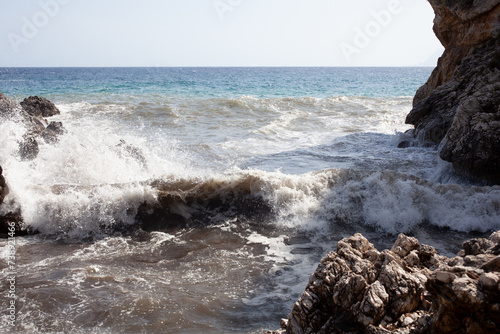 Large waves breaking over rocks © bepsphoto