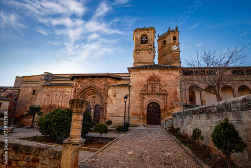 View of Church of the Santisima Trinidad of Alcaraz, Albacete, Castilla la Mancha, Spain, with the Tardon tower in the background photo