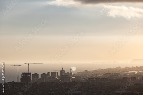 City view, sunset, smoke, crane, construction, pollution