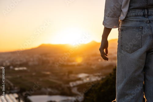 Woman s Hand at Sunset Golden Hour with Denim Vest CoPy Space