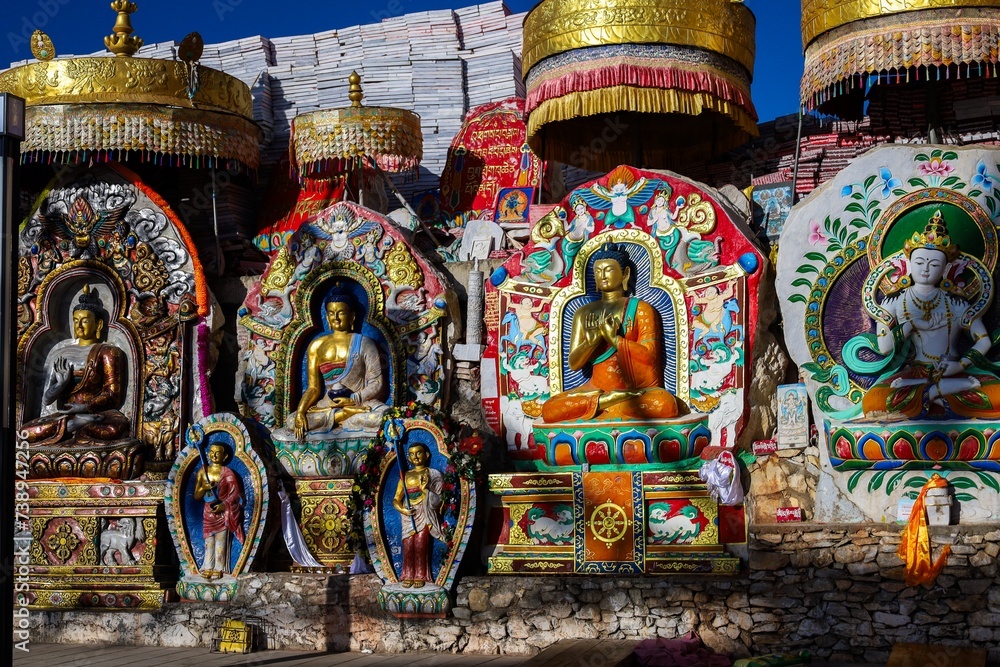 Discover the mesmerizing charm of Senzi town nestled in Yushu, showcasing a vibrant assembly of Buddhist statues and adorned with the planet's largest collection of Tibetan prayer stones (mani stones)