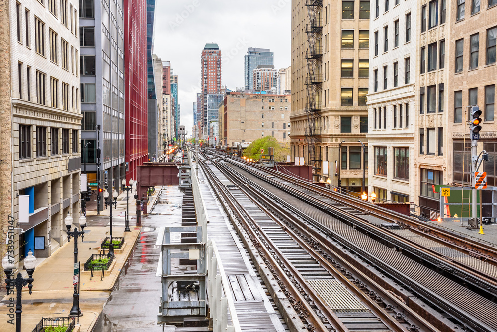 Empty elevated tracks with switches and signals in downtown Chicago on a cloudy srping day