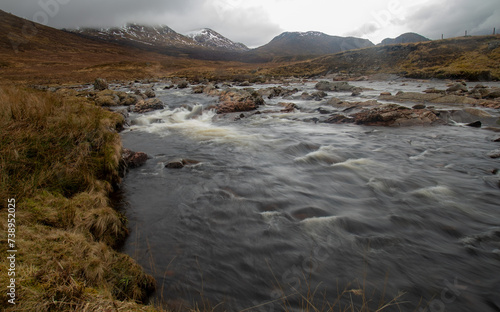 Obraz na plátně Slow shutter release of a fast flowing river in the highlands of Scotland