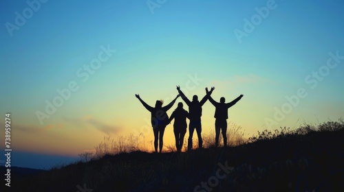 A picturesque scene of camaraderie as silhouettes stand atop a desert hill  bathed in the warm glow of a setting sun  their outstretched arms reaching for the vast sky above while the rugged mountain
