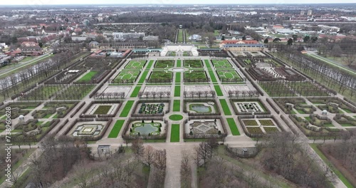 Touristic baroque herrenhauser gardens in Hannover, Germany. City park, flora and fauna in the city. Green city, touristic attraction and landmark. Birds eye aerial drone view. photo