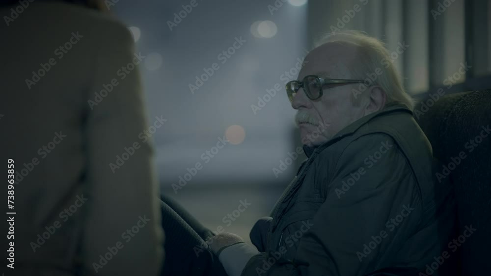 Kind Woman Helping Sad Elderly Homeless Man Outside In Cold Night Kind Woman Helping Sad Elderly Homeless Man Outside In Cold Night