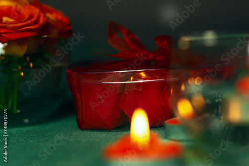 Bouquet of roses, candles and gifts, card for February 14, Valentine's Day, March 8, International Women's Day, wedding, birthday, mother's day, blurred background, bokeh.