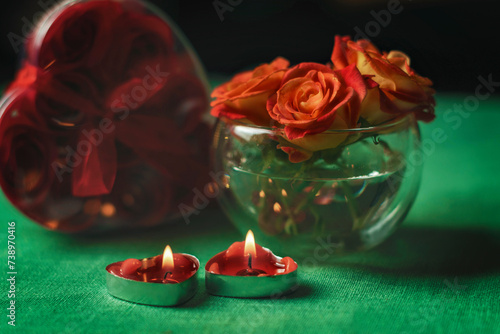 Bouquet of roses, candles and gifts, card for February 14, Valentine's Day, March 8, International Women's Day, wedding, birthday, mother's day, blurred background, bokeh.