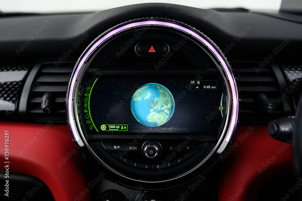 Satellite navigation system in a car showing the globe