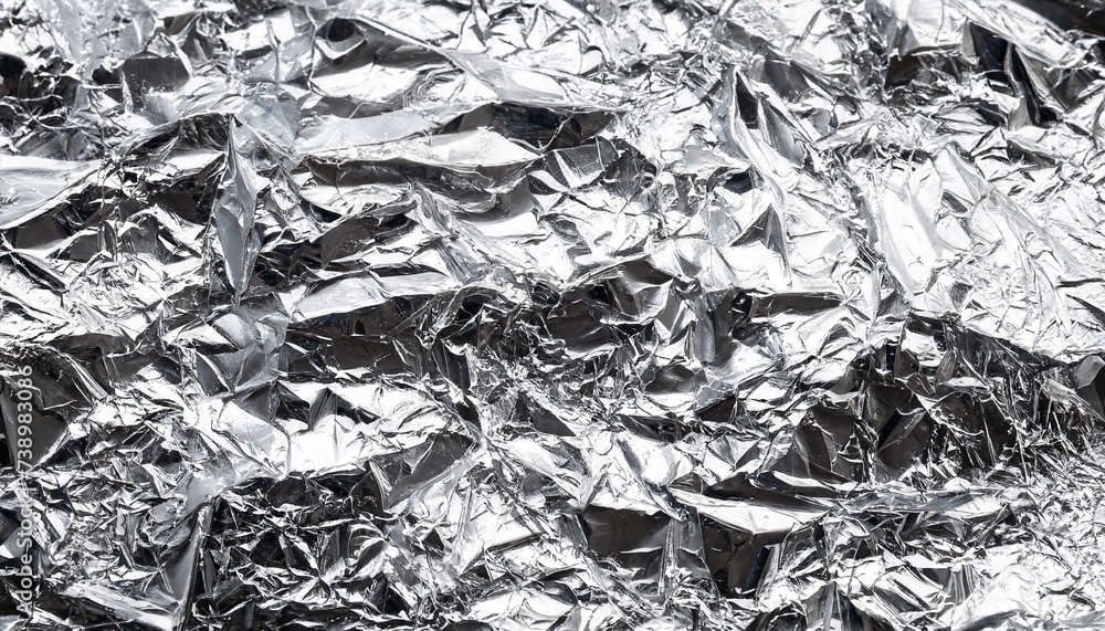 Texture of crumpled silver foil. Close up, concept for design or background Texture of crumpled silver foil. Close up, concept for design or background