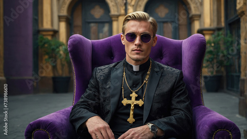 young priest in black cassock sitting on a purple armchair in a room in a luxurious apartment