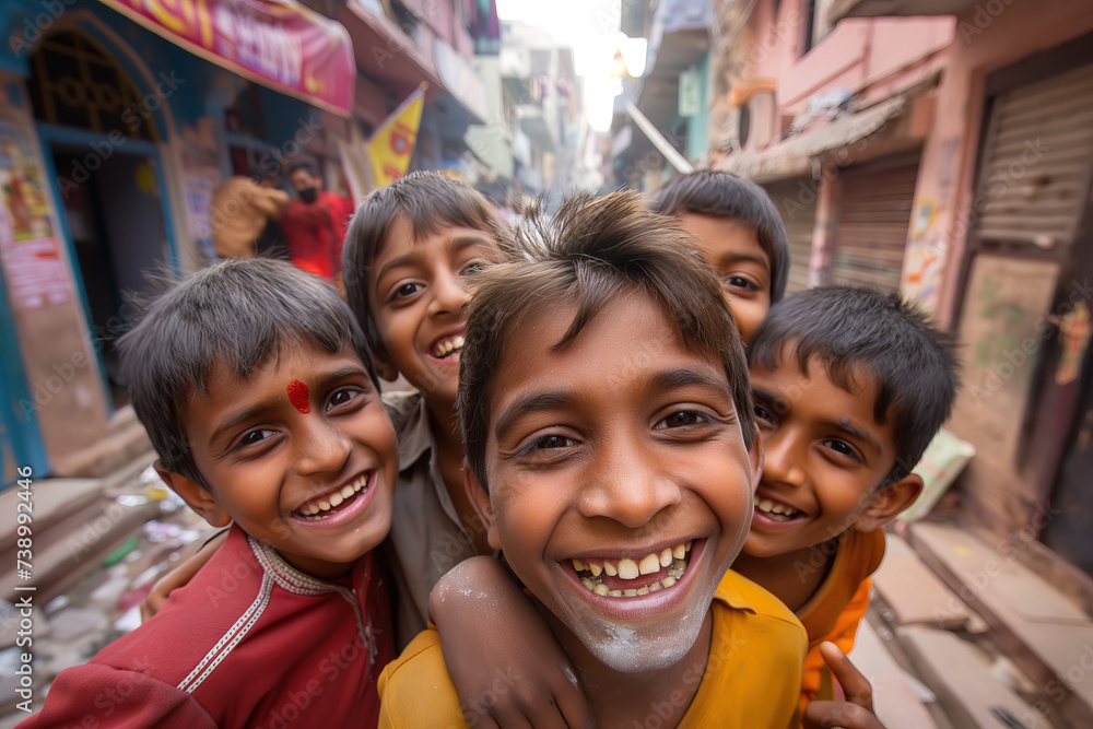 A group of boys on the street in India, smile and laugh to the camera, wide angle close up A group of boys on the street in India, smile and laugh to the camera, wide angle close up