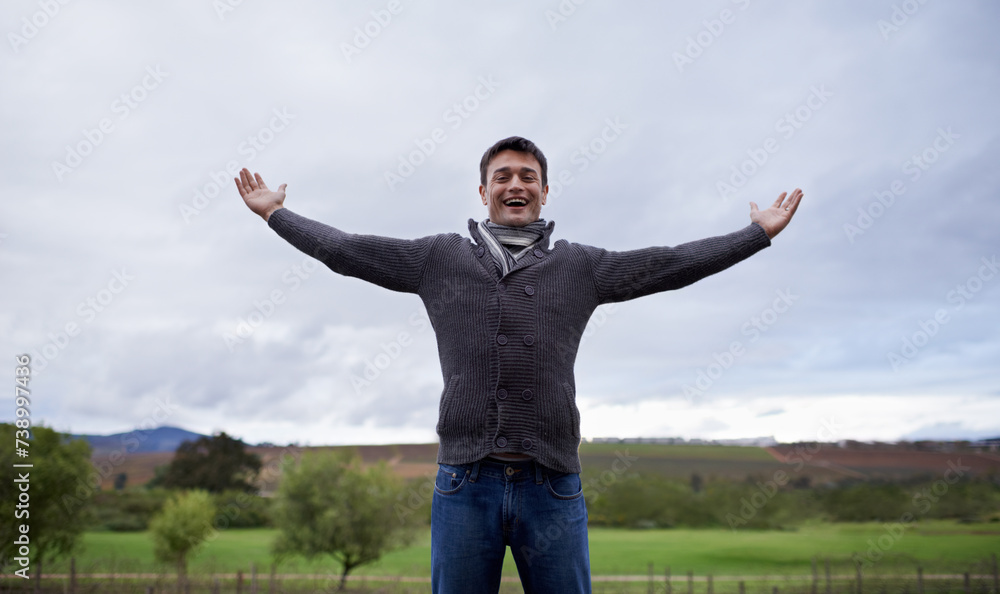 Man, portrait and happiness with freedom or sky for relax, travel and winter adventure on holiday or vacation. Person, tourist and face with smile in nature, outdoor and countryside with wellness Man, portrait and happiness with freedom or sky for relax, travel and winter adventure on holiday or vacation. Person, tourist and face with smile in nature, outdoor and countryside with wellness